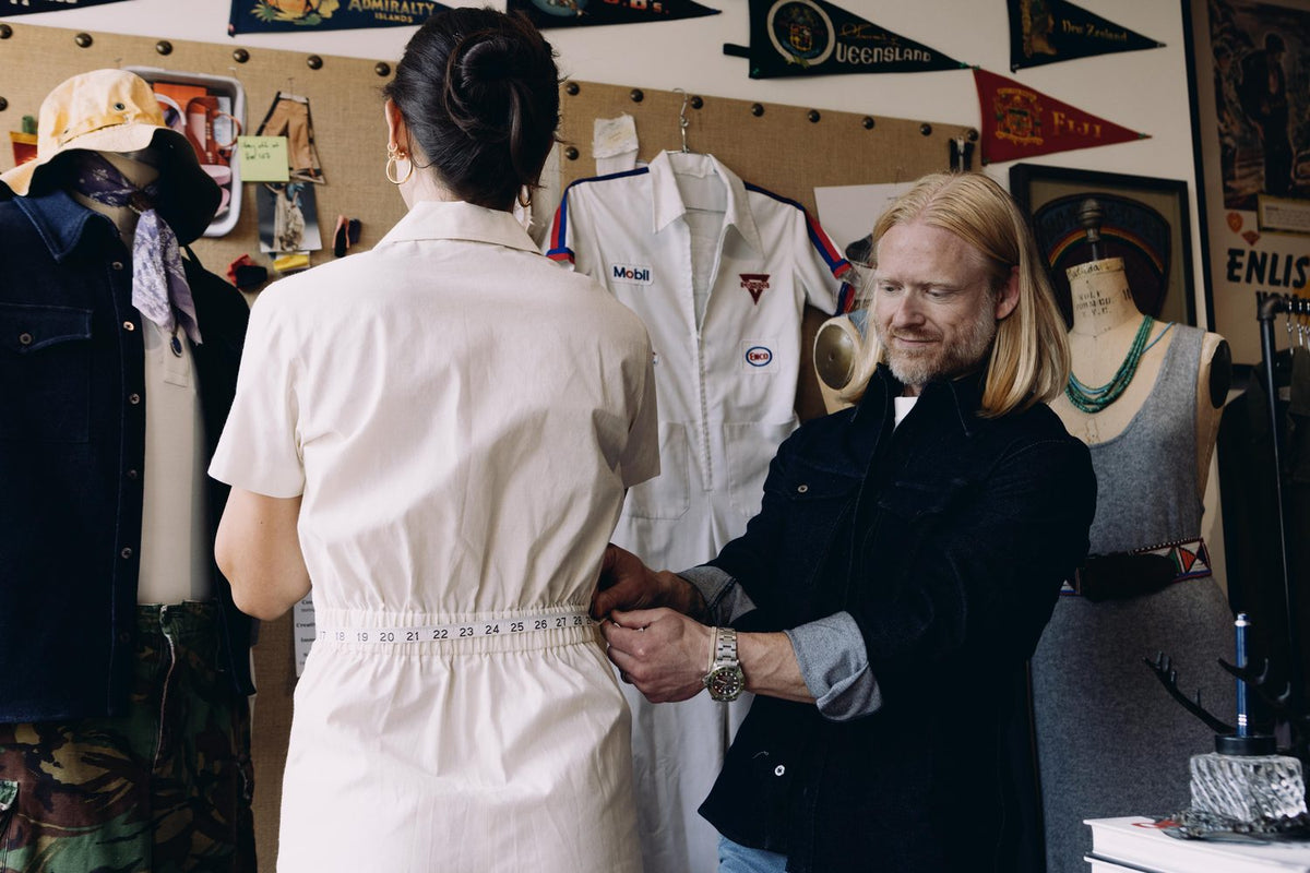 Amy and Scott reviewing references at the studio table