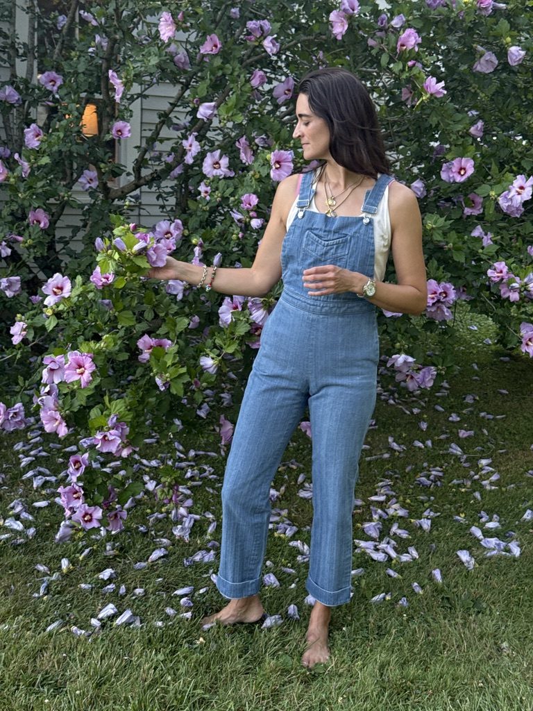 Amy in the Rosie Denim Overall over the Le Mans Tank, garden in bloom