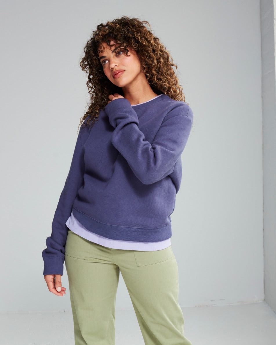 The Grove Sweatshirt worn over a tee for transitional weather